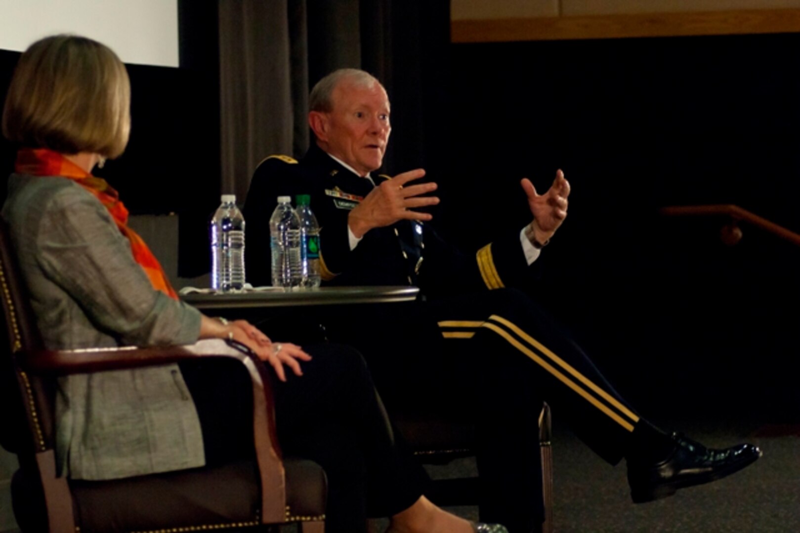 U.S. Army Gen. Martin E. Dempsey, the chairman of the Joint Chiefs of Staff, right, answers a question during a town hall with service members, families and civilians in Seoul, South Korea, Sept. 30, 2013. Dempsey and his wife, Deanie Dempsey, visited with over 300 military community members stationed throughout South Korea, where they spoke about the goals and challenges of the Department of Defense. (Photo by Army Staff Sgt. Luke A. Graziani)