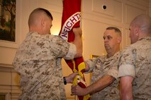 Brigadier General Kevin Killea passes the MCWL colors to Brigadier General Dale Alford during the Marine Corps Warfighting Laboratory's Change of Command ceremony.