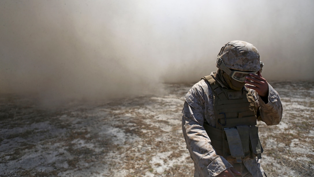 A Marine assigned to Company A, 1st Battalion, 11th Marine Regiment, 1st Marine Division, prepares an M777 howitzer to fire at Marine Corps Base Camp Pendleton, June 17, 2015. CH-53E Super Stallions transported howitzers and ammunition as part of 1/11’s quarterly exercise to test the artillery Marines’ proficiency and readiness.