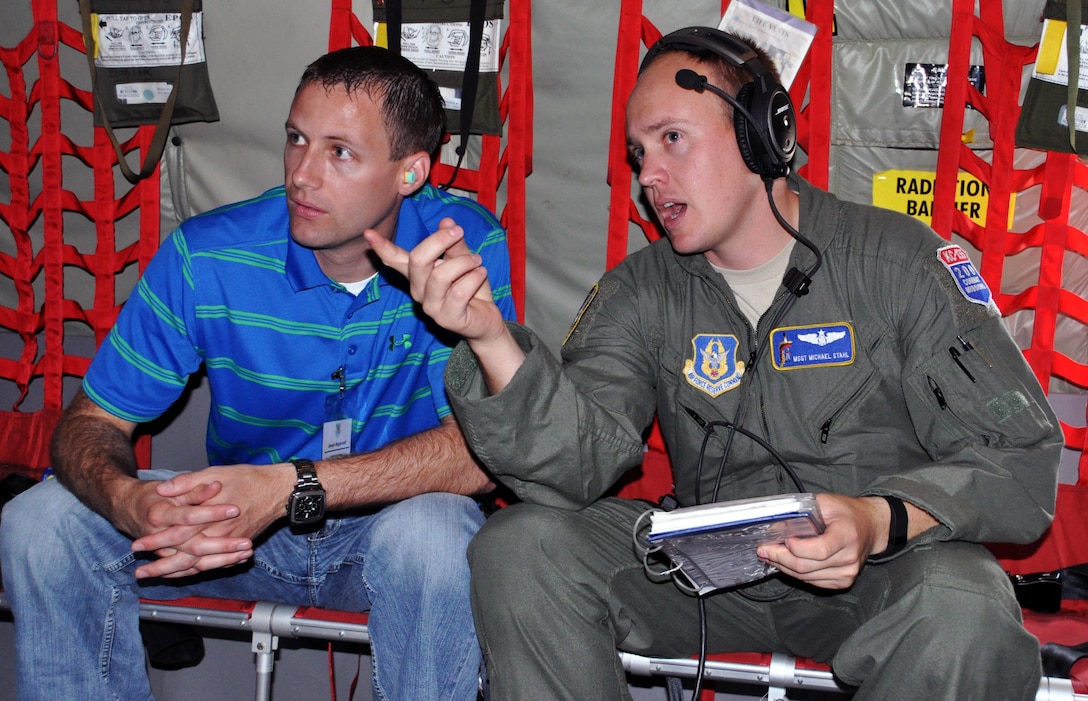 Joe Biggerstaff, AGCO Corporation senior project manager, speaks with his employee, Master Sgt. Michael Stahl, 18th Air Refueling Squadron boom operator, during a "bosslift" sponsored by the local Employer Support of the Guard and Reserve (ESGR), June 6, 2015. More than 19 local employers participated in the flight. (U.S. Air Force photo by Capt. Zachary Anderson)
