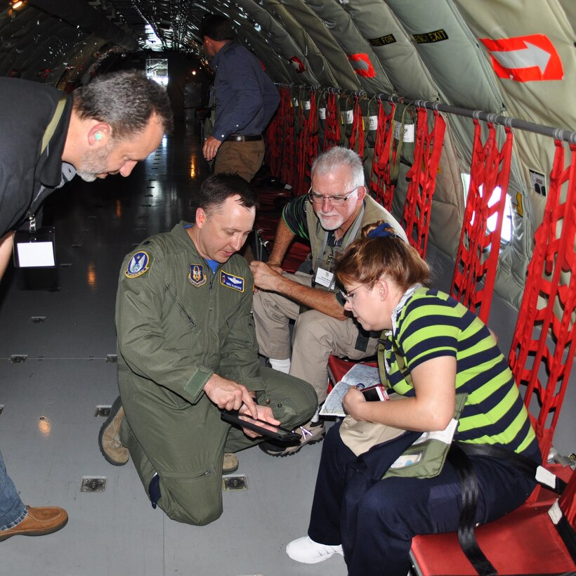 Lt. Col. Michael Kleespie, 18th Air Refueling Squadron pilot, explains the flight path to local employers during a "bosslift" sponsored by the local Employer Support of the Guard and Reserve (ESGR), June 6, 2015. Nineteen employers of 931st Air Refueling Group Airmen received a first-hand look at how their Reservist employee supports strategic reach. (U.S. Air Force photo by Tech. Sgt. Abigail Klein)
