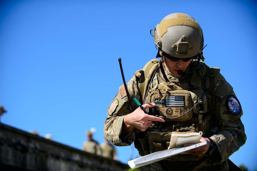 Staff Sgt. Todd Jensen, a Washington Air National Guard joint terminal attack controller, directs gunfire of an A-10 Thunderbolt II during a training exercise June 12, 2015, at Adazi Training Area, Latvia. JTACs from various units around the Air Force joined exercise Saber Strike 15 to work with ally and partner nation counterparts to provide precise and directed aircraft support to Army units participating in the exercise. Saber Strike 15 is a multinational exercise with over 6,000 service members learning from each other and helping promote stability in the Baltic region. (U.S. Air Force photo/Staff Sgt. Armando A. Schwier-Morales)