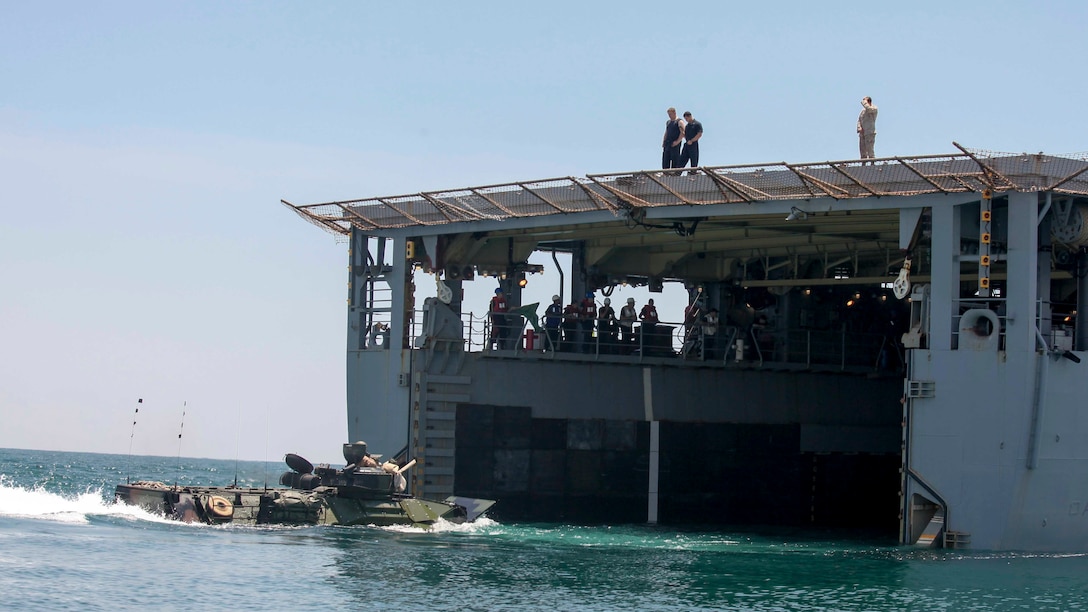 Marines with Amphibious Assault Platoon, Company E, Battalion Landing Team 2/6, load their amphibious assault vehicles onto the USS Oak Hill to participate in a two-week certification exercise off the coast of Marine Corps Base Camp Lejeune, June 17, 2015. Marines with the 26th MEU and sailors with the Kearsarge Amphibious Readiness Group are being evaluated by Expeditionary Operations Training Group during the scenario-based amphibious integration exercise in preparation for a deployment later this fall.