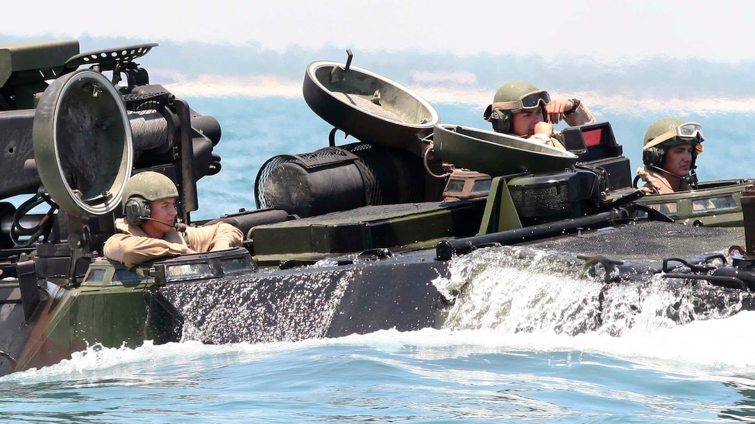 Marines with Amphibious Assault Platoon, Company E, Battalion Landing Team 2/6, load their amphibious assault vehicles onto the USS Oak Hill to participate in a two-week certification exercise off the coast of Marine Corps Base Camp Lejeune, June 17, 2015. Marines with the 26th MEU and sailors with the Kearsarge Amphibious Readiness Group are being evaluated by Expeditionary Operations Training Group during the scenario-based amphibious integration exercise in preparation for a deployment later this fall.