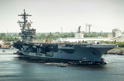 150616-N-MA158-001 PORTSMOUTH, Virginia (June 16, 2015) Aircraft carrier USS George H.W. Bush is aided by tugboats into Norfolk Naval Shipyard (NNSY) for an eight-month long Planned Incremental Availability (PIA).