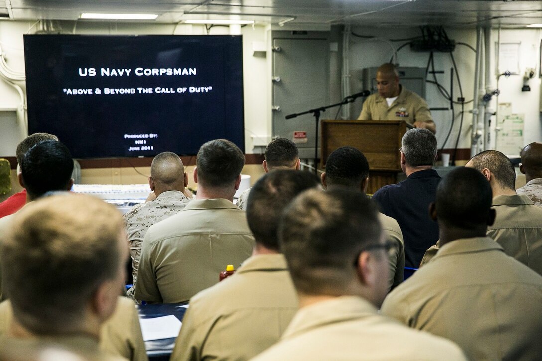 U.S. Sailors and Marines with the Essex Amphibious Ready Group and 15th Marine Expeditionary Unit join to celebrate the Hospital Corps’ 117th birthday aboard the USS Essex (LHD 2) at sea in the Indian Ocean, June 17, 2015. This ceremony was an opportunity for the Sailors and Marines aboard to recognize the hard work each corpsman around the world puts forth to keep the Marines and Sailors in their care safe and healthy. (U.S. Marine Corps photo by Cpl. Anna Albrecht/Released)