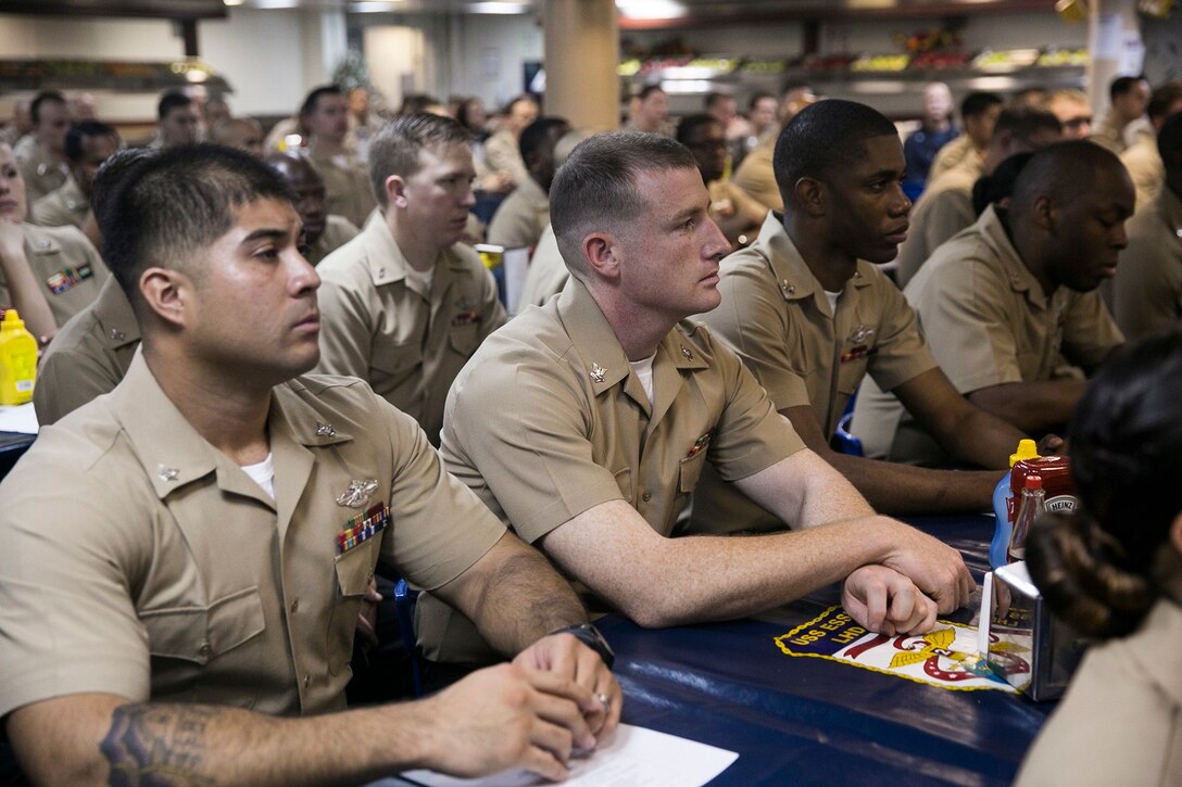 U.S. Sailors and Marines with the Essex Amphibious Ready Group and 15th Marine Expeditionary Unit join to celebrate the Hospital Corps’ 117th birthday aboard the USS Essex (LHD 2) at sea in the Indian Ocean, June 17, 2015. This ceremony was an opportunity for the Sailors and Marines aboard to recognize the hard work each corpsman around the world puts forth to keep the Marines and Sailors in their care safe and healthy. (U.S. Marine Corps photo by Cpl. Anna Albrecht/Released)
