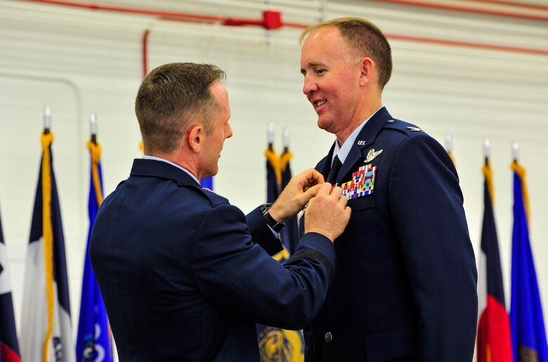 Brig. Gen. John A. Cherrey, Air Education and Training Command director of intelligence, operations and nuclear integration, presents Col. Todd D. Canterbury, 33rd Fighter Wing commander, the Legion of Merit medal during a change of command ceremony, June 19, 2015, on Eglin Air Force Base, Florida. The Nomads said farewell to Col. Canterbury, who departs for a new position within the F-35 Integration Office at the Pentagon in Washington D.C. (U.S. Air Force photo/Staff Sgt. Marleah Robertson)