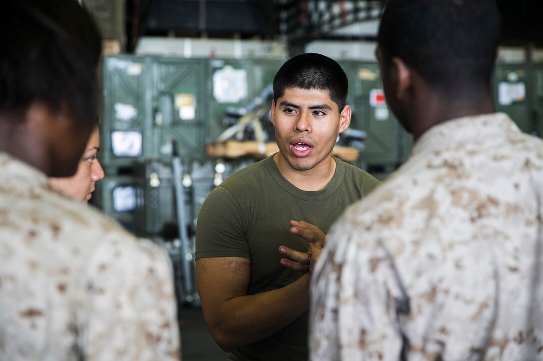 U.S. Marine Cpl. Robert Streety instructs Marines during Marine Corps Martial Arts Program training aboard the USS Essex (LHD 2) at sea in the Indian Ocean, June 18, 2015. Streety is a wireman with the 15th Marine Expeditionary Unit. MCMAP focuses on hand-to-hand combat and teaches the Marines about their core values, benefitting each of them mentally and physically. (U.S. Marine Corps photo by Cpl. Anna Albrecht/ Released)