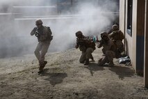 Marines with 1st Battalion, 5th Marine Regiment, demonstrate their combat readiness in the Infantry Immersion Training Facility during a visit by local community leaders aboard Marine Corps Base Camp Pendleton, Calif., June 13, 2015. The guests were given an opportunity to see the training and atmosphere the Marines may experience when deployed.