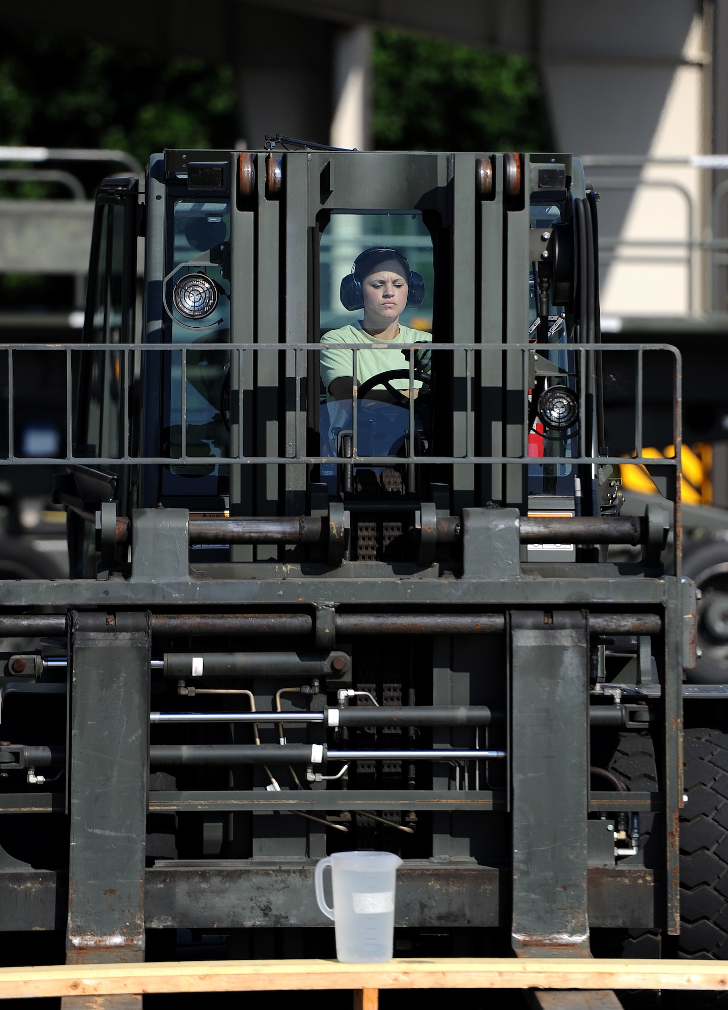 U.S. Air Force Senior Airman Staci Conrad, 94th Aerial Port Squadron, operates a forklift carrying a pallet with a pitcher of water on it while attempting to not spill any during the 10k Forklift Course competition of the Port Dawg Challenge at Dobbins Air Reserve Base, Ga., June 17, 2015. The Port Dawg Challenge was created to enhance and maintain the camaraderie, esprit de corps and prestige of aerial port Airmen while promoting professionalism, leadership, training and communication between "Port Dawgs." (U.S. Air Force photo by Tech. Sgt. Stephen D. Schester/Released)