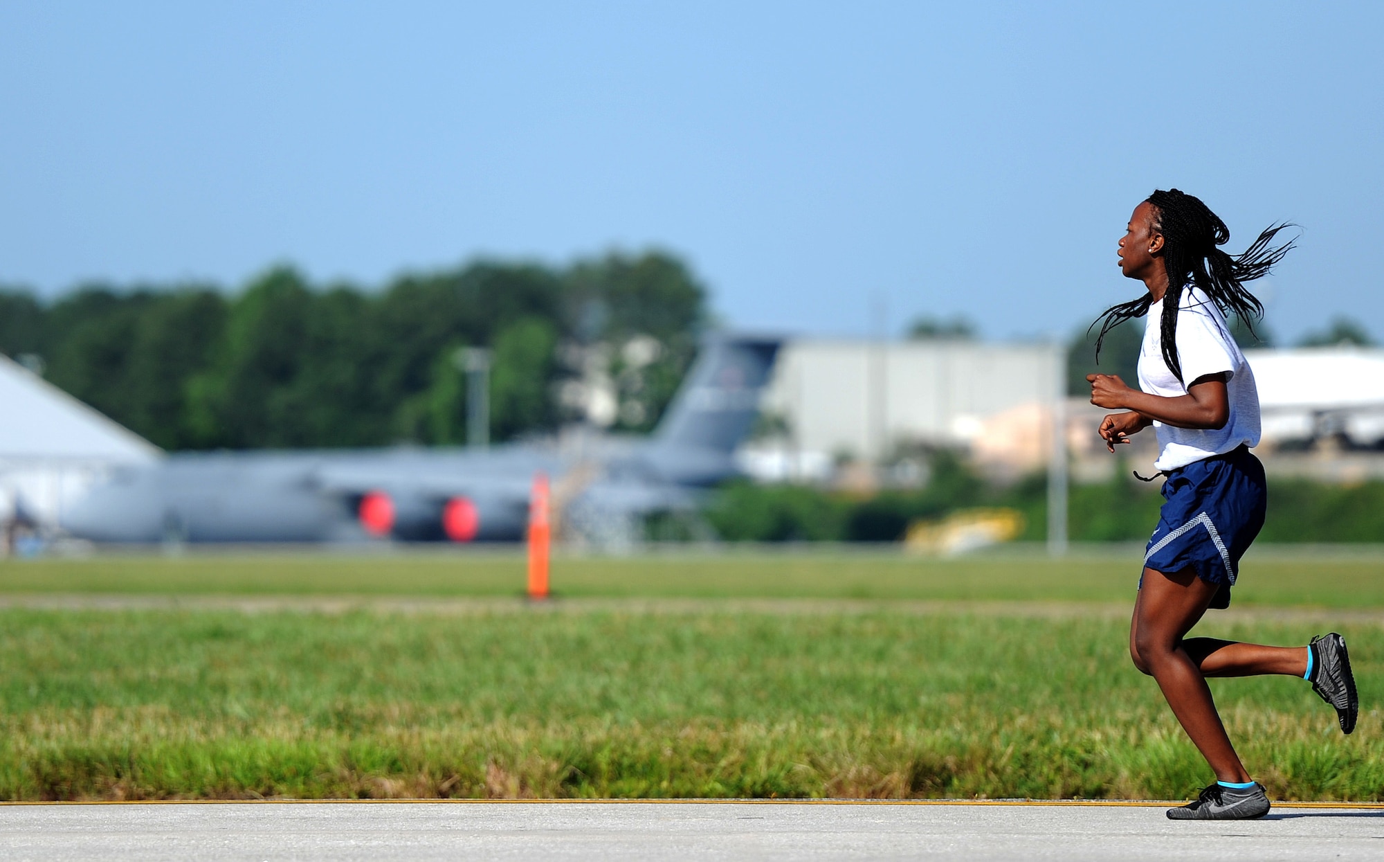 U.S. Air Force Senior Airman Alexandria Moton, 25th Aerial Port Squadron, runs during the fit to fight portion of the Port Dawg Challenge at Dobbins Air Reserve Base, Ga., June 17, 2015. The Port Dawg Challenge was created to enhance and maintain the camaraderie, esprit de corps and prestige of aerial port Airmen while promoting professionalism, leadership, training and communication between "Port Dawgs." (U.S. Air Force photo by Tech. Sgt. Stephen D. Schester/Released)