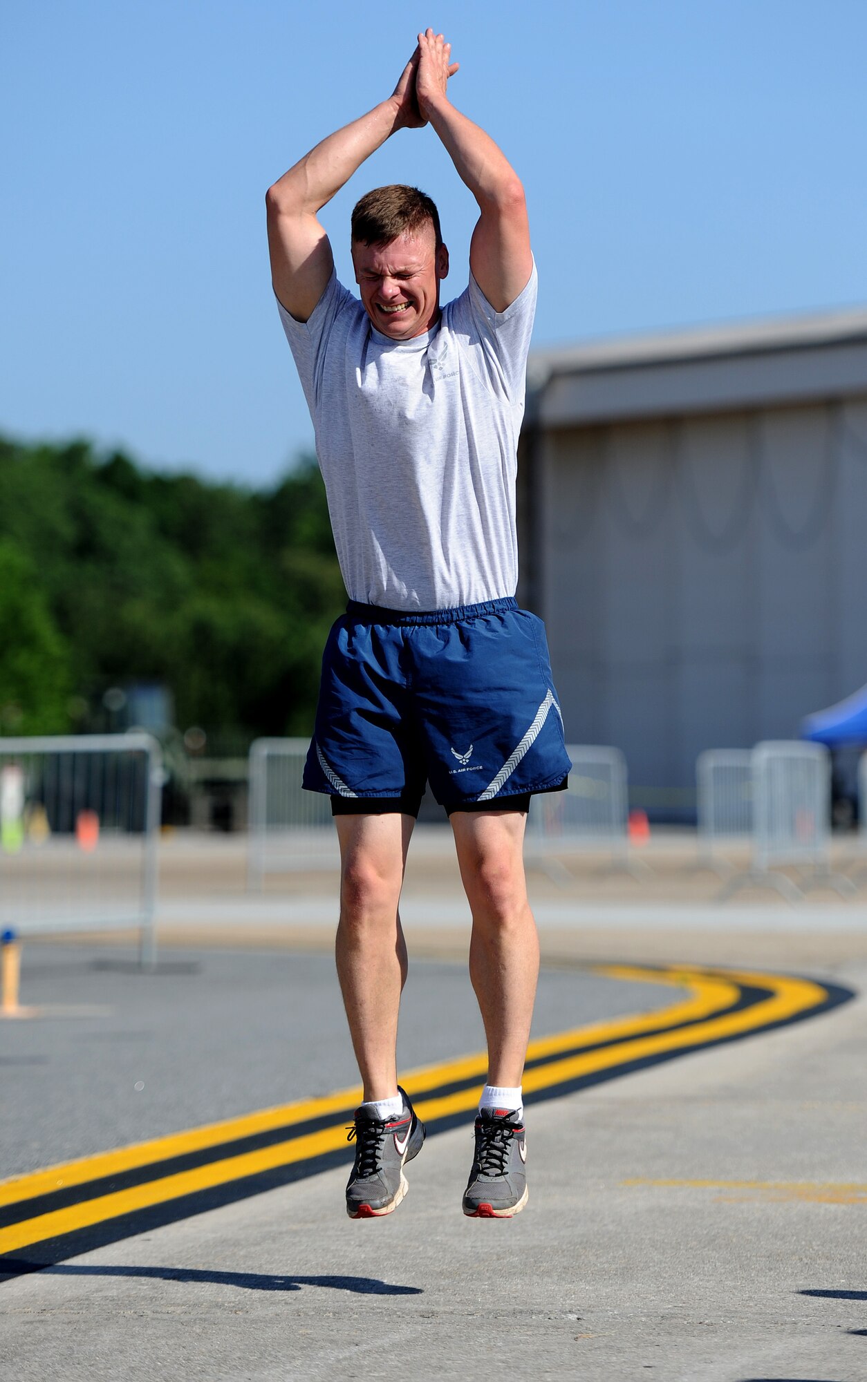 U.S. Air Force Tech. Sgt. Jason Martin, 25th Aerial Port Squadron, performs a burpee during the fit to fight portion of the Port Dawg Challenge at Dobbins Air Reserve Base, Ga., June 17, 2015. The Port Dawg Challenge was created to enhance and maintain the camaraderie, esprit de corps and prestige of aerial port Airmen while promoting professionalism, leadership, training and communication between "Port Dawgs." (U.S. Air Force photo by Tech. Sgt. Stephen D. Schester/Released)