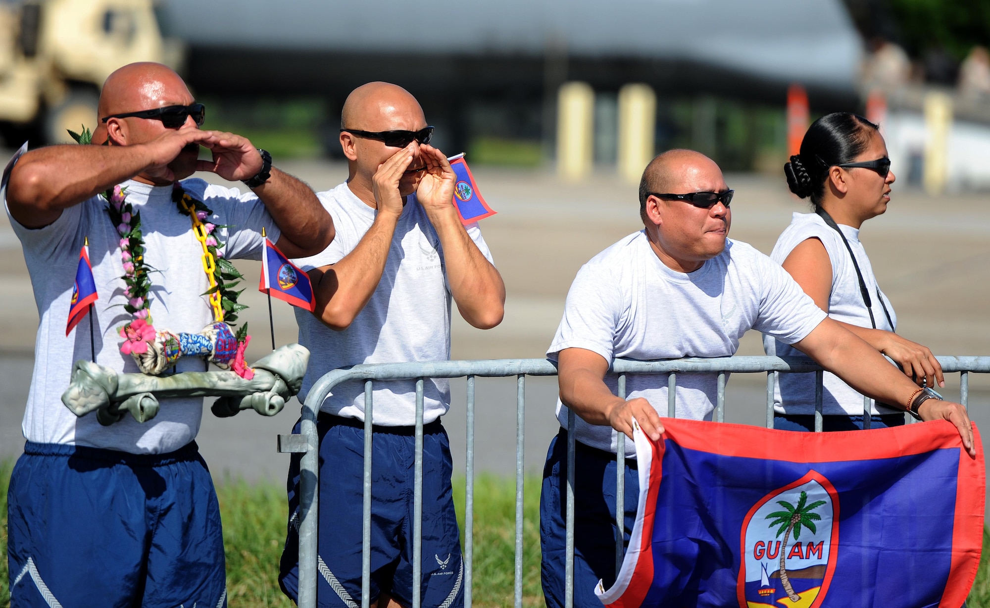 U.S. Air Force team members, assigned to the 44th Aerial Port Squadron, root for their teammates performing in the fit to fight portion of the Port Dawg Challenge at Dobbins Air Reserve Base, Ga., June 17, 2015. The Port Dawg Challenge was created to enhance and maintain the camaraderie, esprit de corps and prestige of aerial port Airmen while promoting professionalism, leadership, training and communication between "Port Dawgs." (U.S. Air Force photo by Tech. Sgt. Stephen D. Schester/Released)