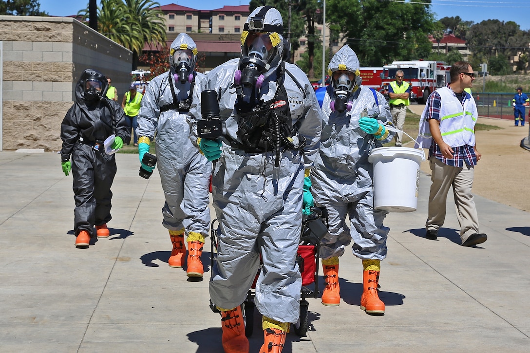 The Camp Pendleton Fire Department, the San Diego County Environmental Health Department and the U.S. Army’s 9th Civil Support Team conducted a hazardous materials exercise at the Paige Fieldhouse here, June 15. The exercise was conducted in conjunction with Semper Durus, a full-scale base Force Protection exercise from June 15 – 19. Semper Durus is a regional command post exercise and is comprised of a series of field training scenarios designed to improve regional command and control, enhance interagency coordination, and improve installation capabilities to respond to, and recover from, a crisis event and validate the installation mission assurance all-hazard plan. 