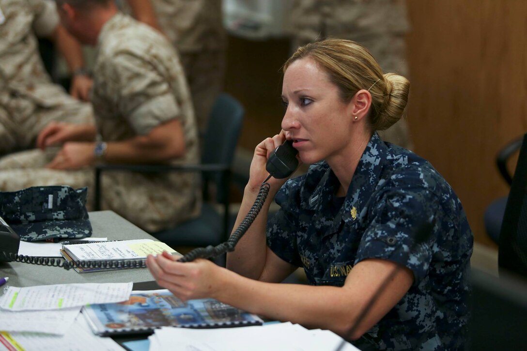 Base personnel manage an Emergency Operations Center, June 18 as part of Exercise Semper Durus, a full-scale base Force Protection exercise from June 15 – 19. 
 Semper Durus is a regional command post exercise and is comprised of a series of field training scenarios designed to improve regional command and control, enhance interagency coordination, and improve installation capabilities to respond to, and recover from, a crisis event and validate the installation mission assurance all-hazard plan.
