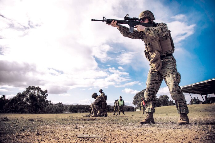 Staff Sergeant Byron England, a native of Johnson City, Kansas, and a member of the Marine Corps Shooting Team, shoots his M16A4 service rifle during a service rifle practice match May 7 at the Puckapunyal Military Area, Victoria, Australia, during the Australian Army Skill at Arms Meeting 2015. AASAM is an annual, international combat-marksmanship competition hosted by the Australian Army, May 6 to 22. The MCST is comprised of 12 Marines with Marine Corps Base Quantico and Marine Rotational Force - Darwin to represent the Marine Corps in this year’s competition. (U.S. Marine Corps photo by Sgt. Marcin Platek/Released)