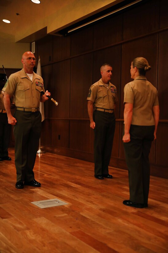 Sgt. Maj. Michael E. Sprague (left), the sergeant major of Force Headquarters Group, Marine Forces Reserve, prepares to exchange the sword of office to Sgt. Maj. William J. Grigsby (middle) by command of Brig. Gen. Helen G. Pratt (right), the commanding general, FHG, MFR, June 19, 2015 at Marine Corps Support Facility New Orleans. Sprague was the first sergeant major selected for FHG in June 2012. (U.S. Marine Corps photo by Sgt. Brytani Musick)