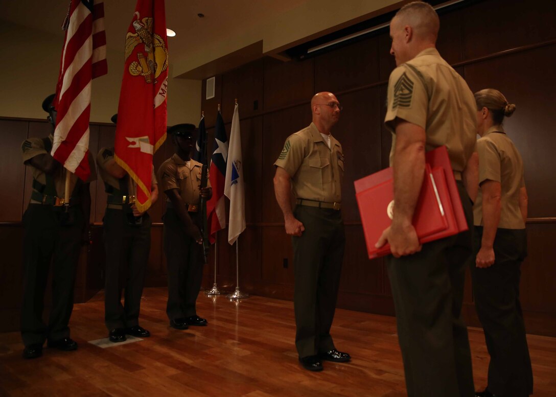 Commanding General of Force Headquarters Group, Marine Forces Reserve, Brig. Gen. Helen G. Pratt (middle), awards Sgt. Maj. Michael E. Sprague (left), with the Legion of Merit award as Sgt. Maj. William J. Grigsby (right), the new FHG sergeant major, stands by during Sprague’s retirement ceremony at Marine Corps Support Facility New Orleans, June 19, 2015. Sprague served as the first sergeant major of FHG, MFR, since June of 2012. (U.S. Marine Corps photo by Sgt. Brytani Musick)
