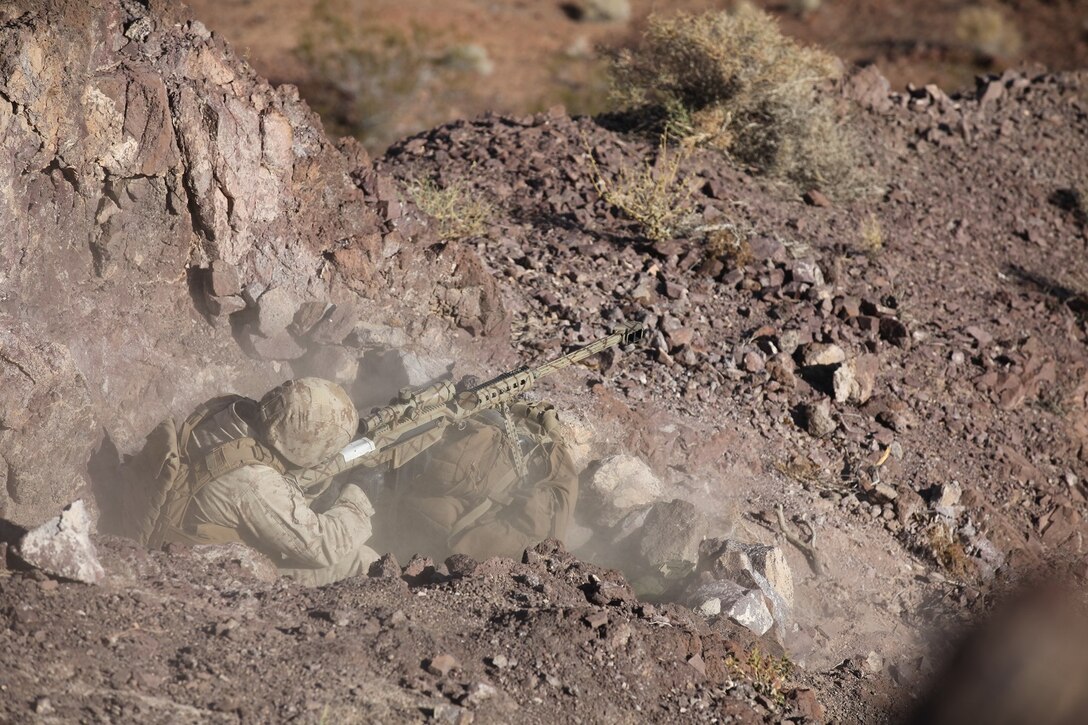A sniper with 1st Battalion, 7th Marine Regiment, 1st Marine Division, I Marine Expeditionary Force, engages targets 880 meters away with a Barrett M82A1 Special Application Scoped Rifle during 1/7’s Marine Corps Combat Readiness Evaluation aboard Marine Corps Air Ground Combat Center Twentynine Palms Calif., June 9, 2015.  Marines from 1/7 and 2nd battalion, 7th Marine Regiment are currently in preparation for deployment with the Special Purpose Marine Air Ground Task Force (SPMAGTF) scheduled to depart in support of Operation Inherent Resolve later this year.