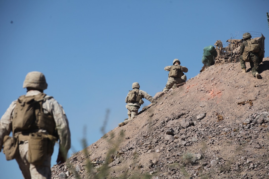 Combat engineers attached to 1st Battalion, 7th Marine Regiment, 1st Marine Division, I Marine Expeditionary Force, prepare to breach obstacles during 1/7’s Marine Corps Combat Readiness Evaluation aboard Marine Corps Air Ground Combat Center Twentynine Palms, Calif., June 9, 2015.  Marines from 1/7 and 2nd Battalion, 7th Marine Regiment are currently in preparation for deployment with the Special Purpose Marine Air Ground Task Force (SPMAGTF) scheduled to depart in support of Operation Inherent Resolve later this year.