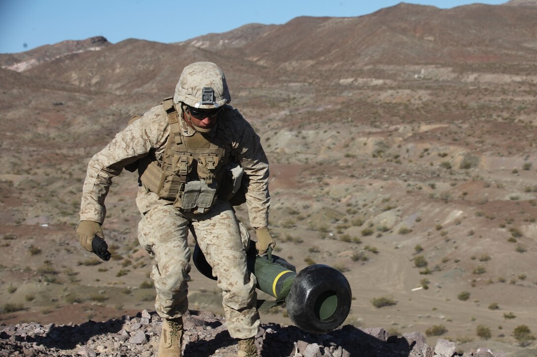 An assaultman with 1st Battalion, 7th Marine Regiment, 1st Marine Division, I Marine Expeditionary Force, moves into position to fire his FGM-148 Javelin during 1/7’s Marine Corps Combat Readiness Evaluation aboard Marine Corps Air Ground Combat Center Twentynine Palms, Calif., June 9, 2015. Marines from 1/7 and 2nd battalion, 7th Marine Regiment are currently in preparation for deployment with the Special Purpose Marine Air Ground Task Force (SPMAGTF) scheduled to depart in support of Operation Inherent Resolve later this year.