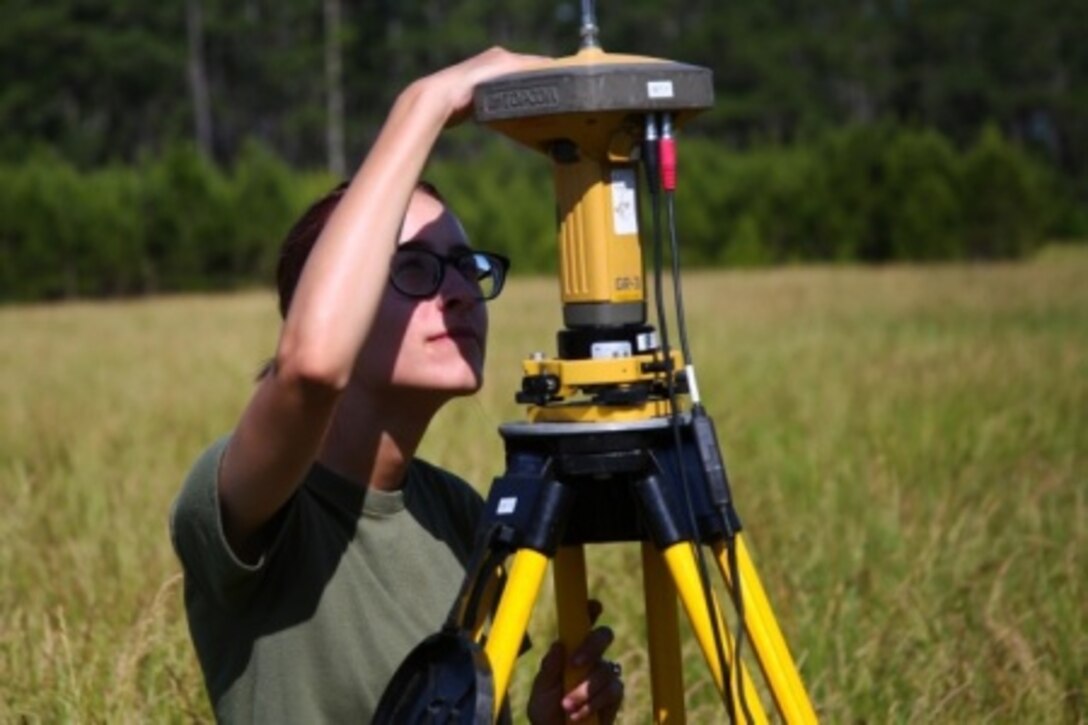 Lance Cpl. Taylor Knight, a geographical intelligence specialist with Battlefield Surveillance Company, 2nd Intelligence Battalion, reads the data output by the base Global Positioning System during geodetic mapping operations aboard Camp Lejeune, North Carolina, May 28, 2015. Six Marines with the company conducted a geographical mapping of Landing Zone Lark, gathering information for pilots to look at, allowing them to determine whether their aircraft is safe to land on the terrain.