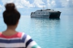 TARAWA, Kiribati (June 2, 2015) An I-Kiribati girl watches as the Military Sealift Command joint high-speed vessel USNS Millinocket (JHSV 3) arrives in support of Pacific Partnership 2015. Tarawa is an atoll and the capital of the Republic of Kiribati, in the central Pacific Ocean and is the first country Millinocket is visiting during PP15. Now in its tenth iteration, Pacific Partnership is the largest annual multilateral humanitarian assistance and disaster relief preparedness mission conducted in the Indio-Asia-Pacific region. While training for crisis conditions, Pacific Partnership missions have provided medical care to approximately 270,000 patients and veterinary services to more than 38,000 animals. Additionally, PP15 has provided critical infrastructure development to host nations through the completion of more than 180 engineering projects. (U.S. Navy photo by Chief Mass Communication Specialist Jonathan R. Kulp/Released)