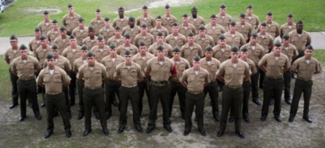 Marines from 1st Battalion, 8th Marine Regiment, 2nd Marine Division pose for a group photo during the 1/8 Lance Cpl. Seminar graduation June 7, 2015, aboard Camp Lejeune, North Carolina. Forty-nine Marines, along with 6 instructors from the battalion, completed the five-day course. (U.S. Marine Corps photo by Cpl. Ryan Young/ released)