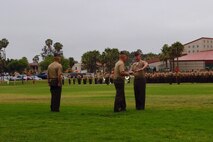 Major Gen. Lawrence D. Nicholson, commanding general of 1st Marine Division, I Marine Expeditionary Force, presents the sword of office to Sgt. Maj. William T. Sowers, 1st Marine Division sergeant major, during a relief and appointment ceremony aboard Marine Corps Base Camp Pendleton, Calif., June 12, 2015. Sowers is returning to the division after serving as the battalion sergeant major for 1st Battalion, 5th Marine Regiment, from June 2008 to November 2010. (U.S. Marine Corps photo by Lance Cpl. Caitlin Bevel)