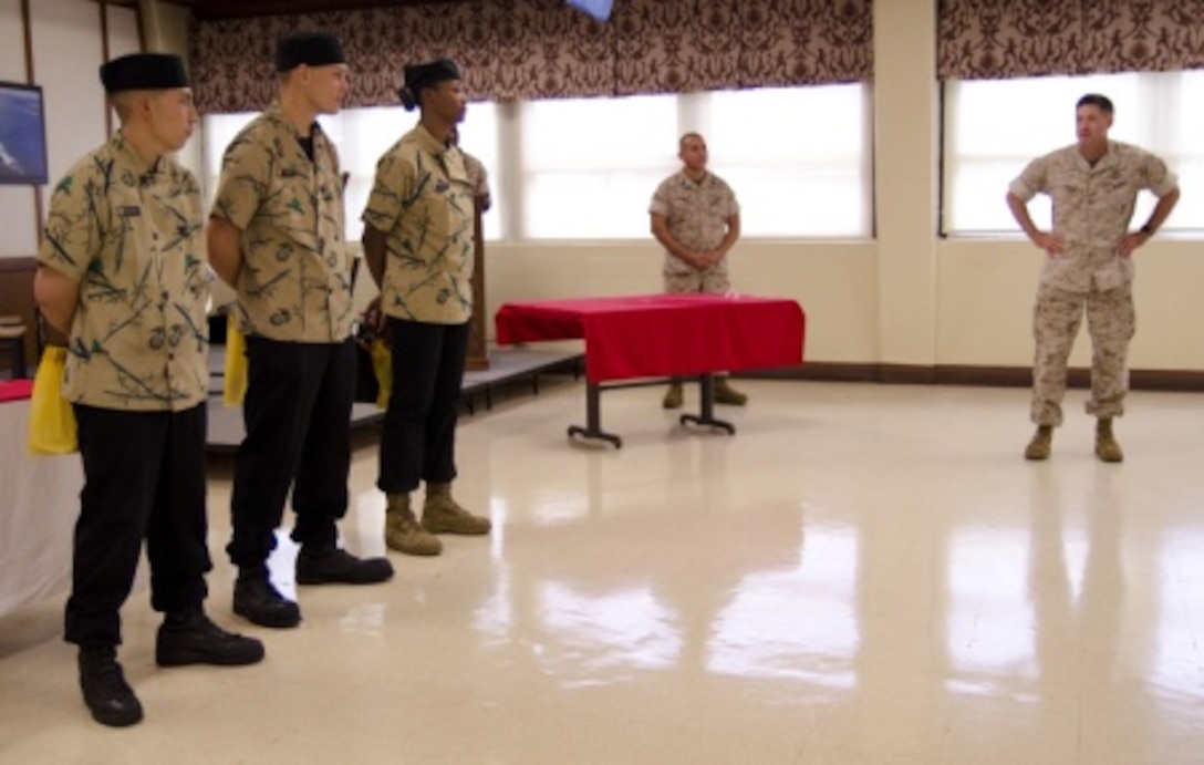 Col. Sean C. Killeen (right), commanding officer of Marine Corps Base Hawaii, commends the three competitors during the Chef of the Quarter competition at Anderson Hall, June 17, 2015. Each competitor took a written test, stood before a board of food service staff noncommissioned officers and, this quarter, prepared a Japanese-themed meal for three judges. The three competing food service specialists could earn up to a maximum of 300 points. Pvt. Precious Felder received first place with 265 points, Cpl. Moises Rodriguez took second place with 234 points and Pfc. Jeff Troyer took third place with 233 points. (U.S. Marine Corps photo by Kristen Wong/Released)