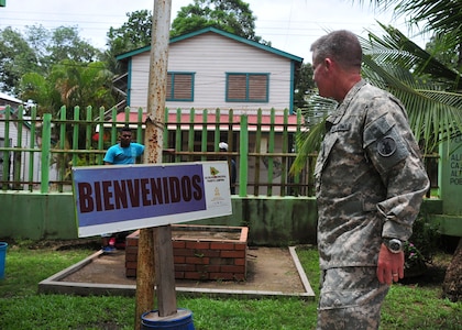 PUERTO LEMPIRA, Honduras – U.S. Army Lt. Col. Daniel Moore, 1-228th Aviation Regiment commander, walks past a sign that says “Welcome” before entering a municipal building in Puerto Lempira, Honduras, June 18, 2015. Moore was part of a 14-member delegation from the Special Purpose Marine Air Ground Task Force-Southern Command and Joint Task Force-Bravo, both stationed at Soto Cano Air Base, Honduras, who met with Gracias a Dios department leaders to provide clarity on the Marines’ upcoming constructions projects in the region. (U.S. Air Force Photo by Capt. Christopher Love)