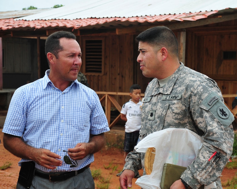 PUERTO LEMPIRA, Honduras – U.S. Army Lt. Col. Carlos Moya, Joint Task Force-Bravo director of civil-military relations, greets Alberto Haylock, Governor of Gracias a Dios Department, after landing at the Puerto Lempira Airport, Honduras, June 18, 2015, for a bi-lateral meeting. Moya, a year-long veteran of JTF-Bravo, came to introduce Haylock and other Gracias a Dios Department leaders to the newly arrived members of the Special Purpose Marine Air Ground Task Force-Southern Command, who will begin construction of a school in Puerto Lempira next week. (U.S. Air Force Photo by Capt. Christopher Love)