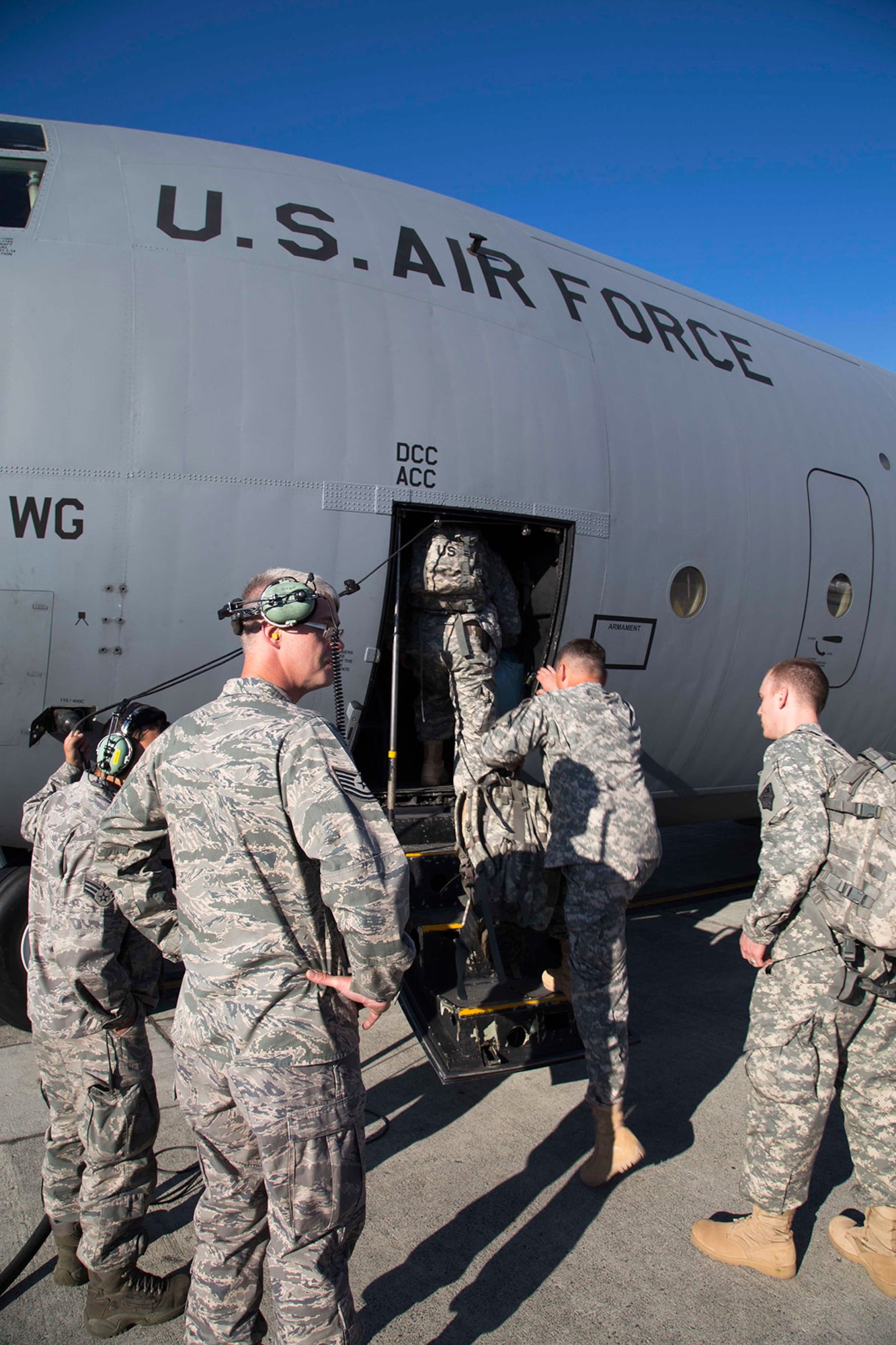 Members of the Alaska National Guard and U.S. Army Alaska’s 3rd Battalion, 21st Infantry Regiment, board an Alaska Air National Guard, C-130 Hercules on Joint Base Elmendorf-Richardson bound for Ulaanbaatar, Mongolia, Monday. (U.S. Army National Guard photo/Sgt. Balinda O’Neal)