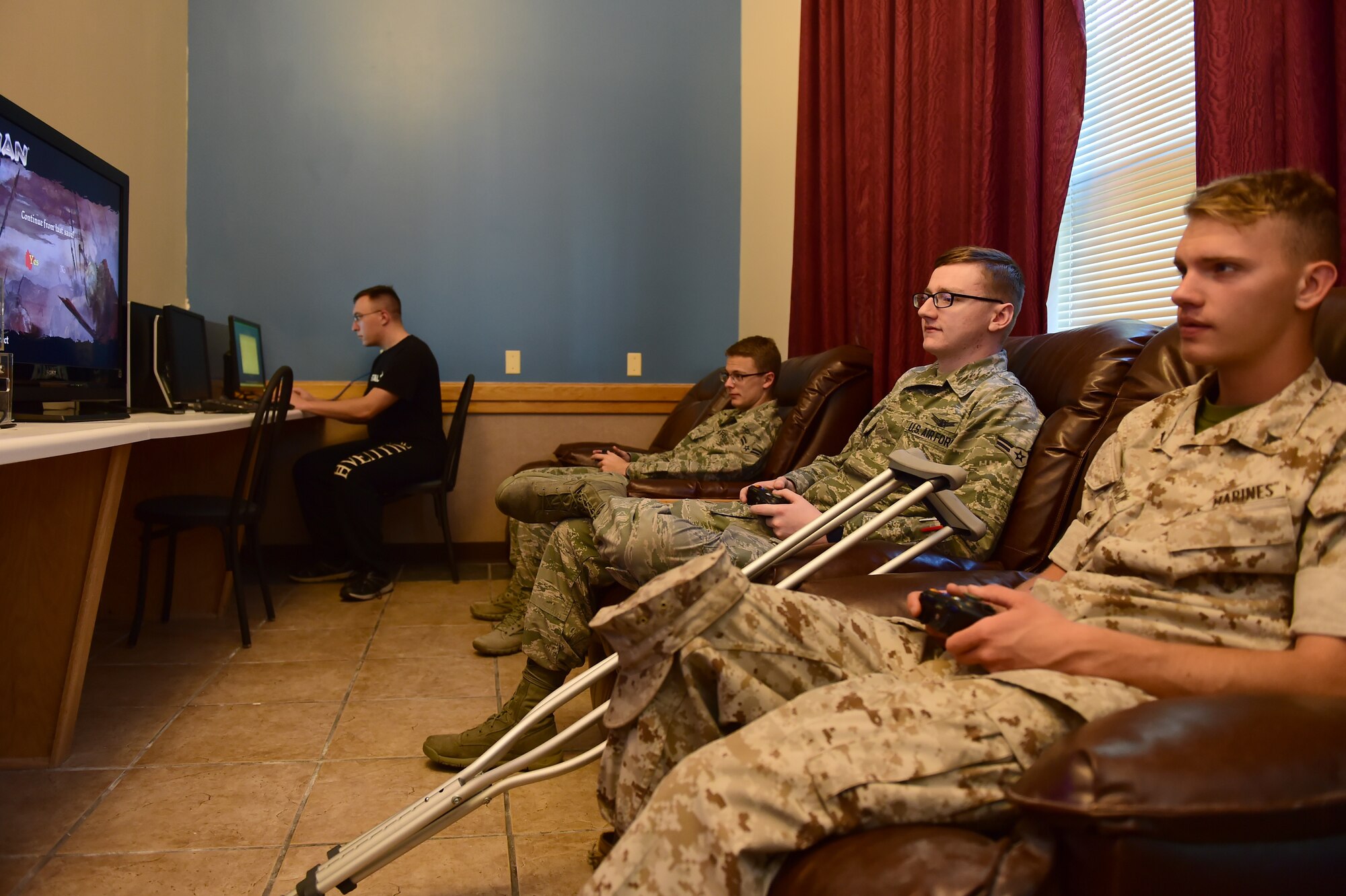 Team Buckley residents of Panther Hall enjoy the new Non-Secure Internet Protocol Router Café June 19, 2015, at Buckley Air Force Base, Colo. The NIPR Café has been built for Panther Hall members so they can have secure Internet access in the dorm. (U.S. Air Force photo by Airman 1st Class Luke W. Nowakowski/Released)