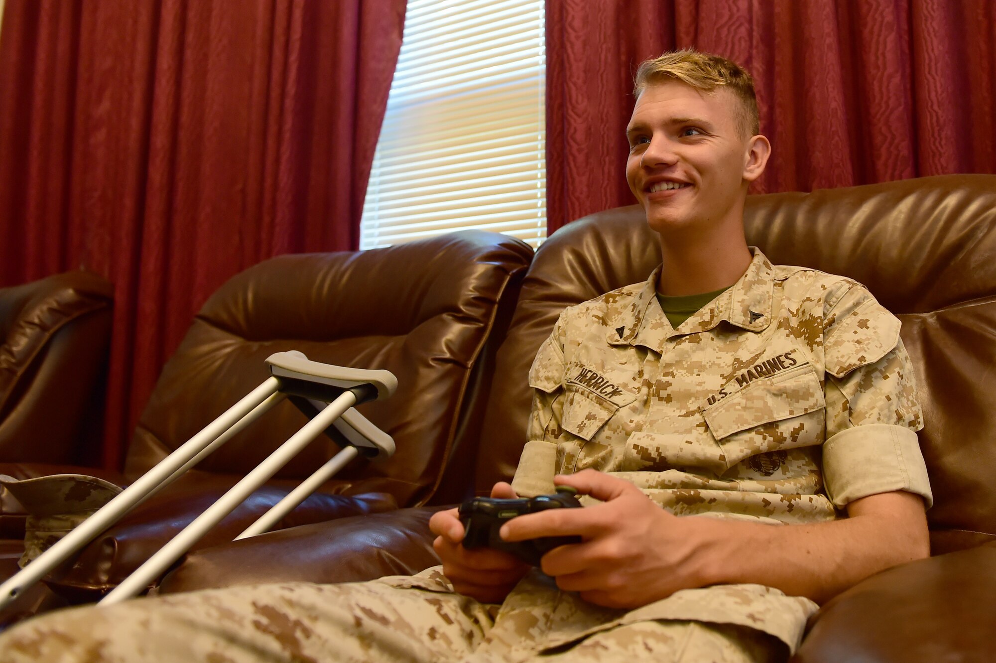 Lance Cpl. Kennedy Herrick, Combat Logistics Battalion Co. A administration clerk, enjoys the new gaming systems installed in Panther Hall June 19, 2015, at Buckley Air Force Base, Colo. A new Non-Secure Internet Protocol Router café has been built for Panther Hall members so they can have secure Internet access in the dorm. (U.S. Air Force photo by Airman 1st Class Luke W. Nowakowski/Released)
