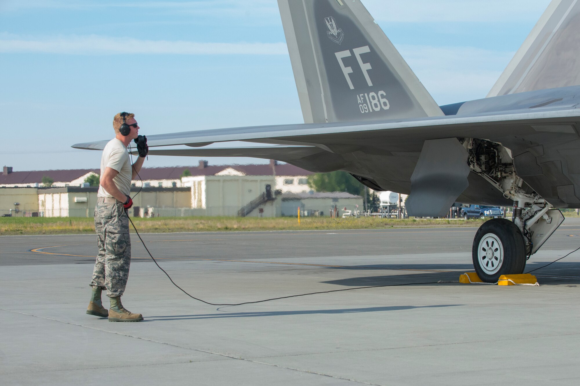 Senior Airman Craig Lively, 94th Aircraft Maintenance Unit Crew Chief, Joint Base Langley-Eustis, conducts a pre-launch inspection of an F-22 Raptor during Exercise Northern Edge 15 at JBER, Alaska, June 15, 2015. Pilots and maintainers from the 192nd Fighter Wing, Virginia Air National Guard and active duty Airmen from the 1st Fighter Wing, Joint Base Langley-Eustis are participating in the two-week training exercise. Northern Edge 2015 is Alaska’s premier joint training exercise designed to perfect mission operations, techniques and procedures as well as enhance interoperability across all military services, Reserves and Air National Guard forces. (U.S. Air Force photo by Staff Sgt. Jonathan Garcia/Released)