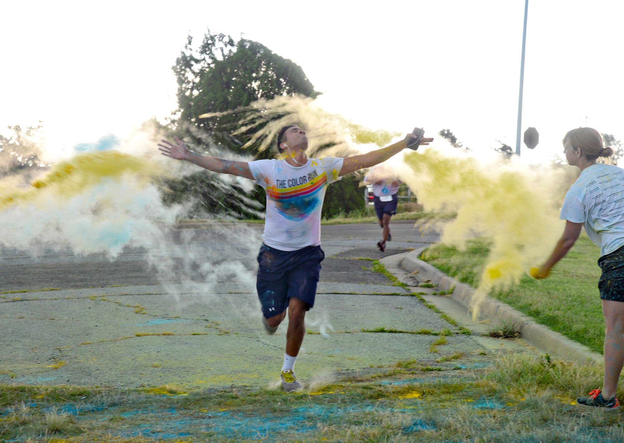 A rainstorm on the horizon didn’t stop the 2015 Diversity Day 5K Color Run on June 12. Crossing the finish line in a cloud of color is Senior Airman Briante Brown from the 552nd Air Control Network Squadron. The top three male runners were 2nd Lt. Neal Lucas, 960th Airborne Air Control Squadron; Maj. Jonathan Clough, 963rd Airborne Air Control Squadron; and Cadet Nate Woodford, U.S. Air Force Academy. The top three women were Senior Airman Patricia Hall-Coleman, 552nd Aircraft Maintenance Squadron; Capt. Jeri-Lynn Harper, 965th Airborne Air Control Squadron; and Airman 1st Class Jolanta Gorska, 552nd Maintenance Squadron. (Air Force photo by Kelly White/Released)
