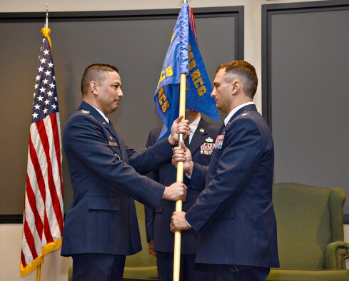 During a June 12 change of command ceremony at the Hill Conference Center, Lt. Col. Seth Tribett received the squadron guidon from Col. Robert Borja, the commander of the 369th Recruiting Group, Joint Base San Antonio-Lackland, Texas, to become the new commander of the 349th Recruiting Squadron here at Tinker Air Force Base. The squadron has 49 recruiting offices across Oklahoma, Kansas, Missouri and Arkansas. (Air Force photo by Kelly White/Released)