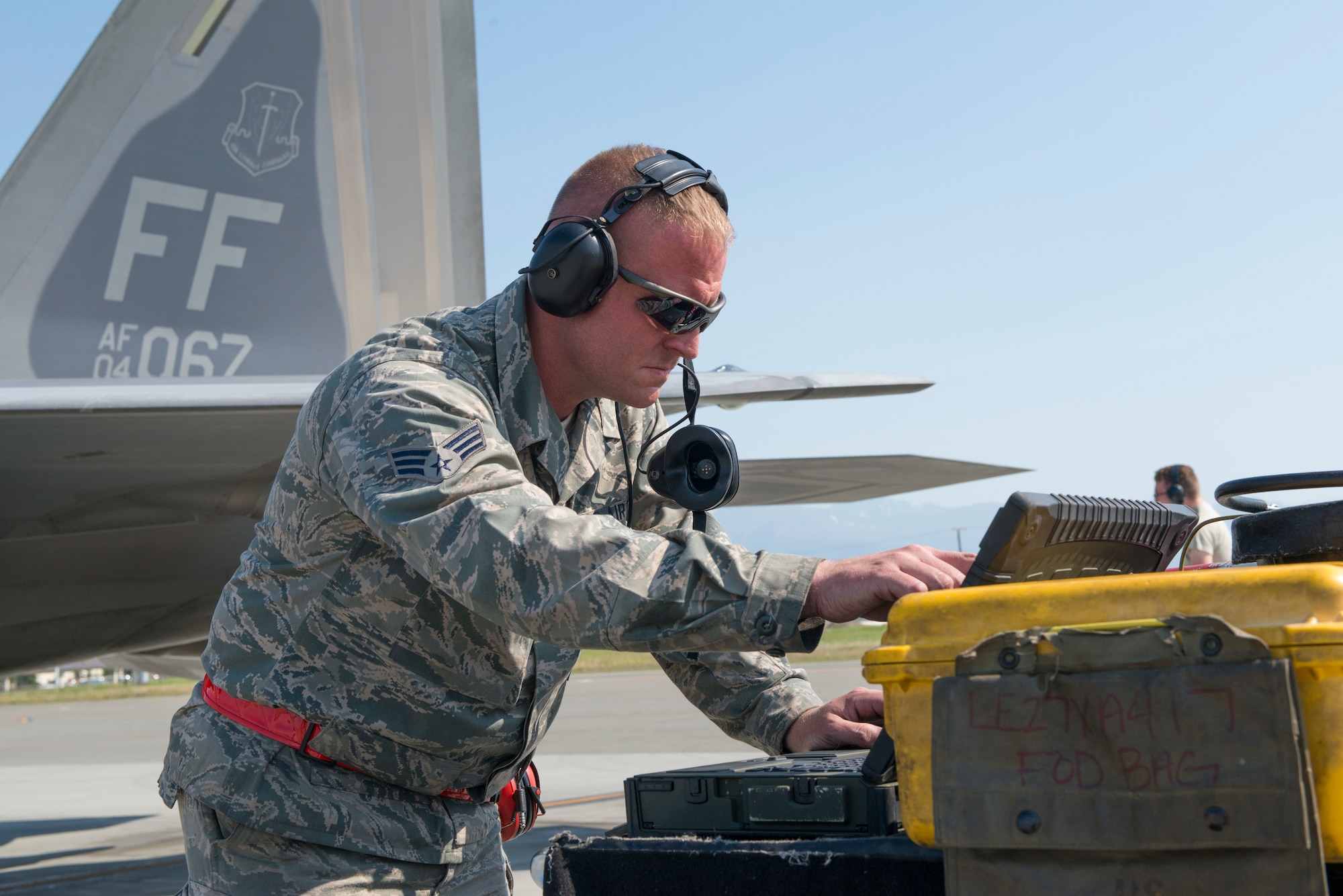 Senior Airman Greg Oliver, 94th Aircraft Maintenance Unit crew chief, 192nd Fighter Wing, Virginia Air National Guard, performs a pre-flight check during Exercise Northern Edge 2015 at JBER, Alaska, June 15, 2015. Northern Edge is Alaska’s premier joint training exercise designed to perfect mission operations, techniques and procedures as well as enhance interoperability across all military branches, Reserve and Air National Guard forces. (U.S. Air Force photo by Staff Sgt. Jonathan Garcia/Released)
