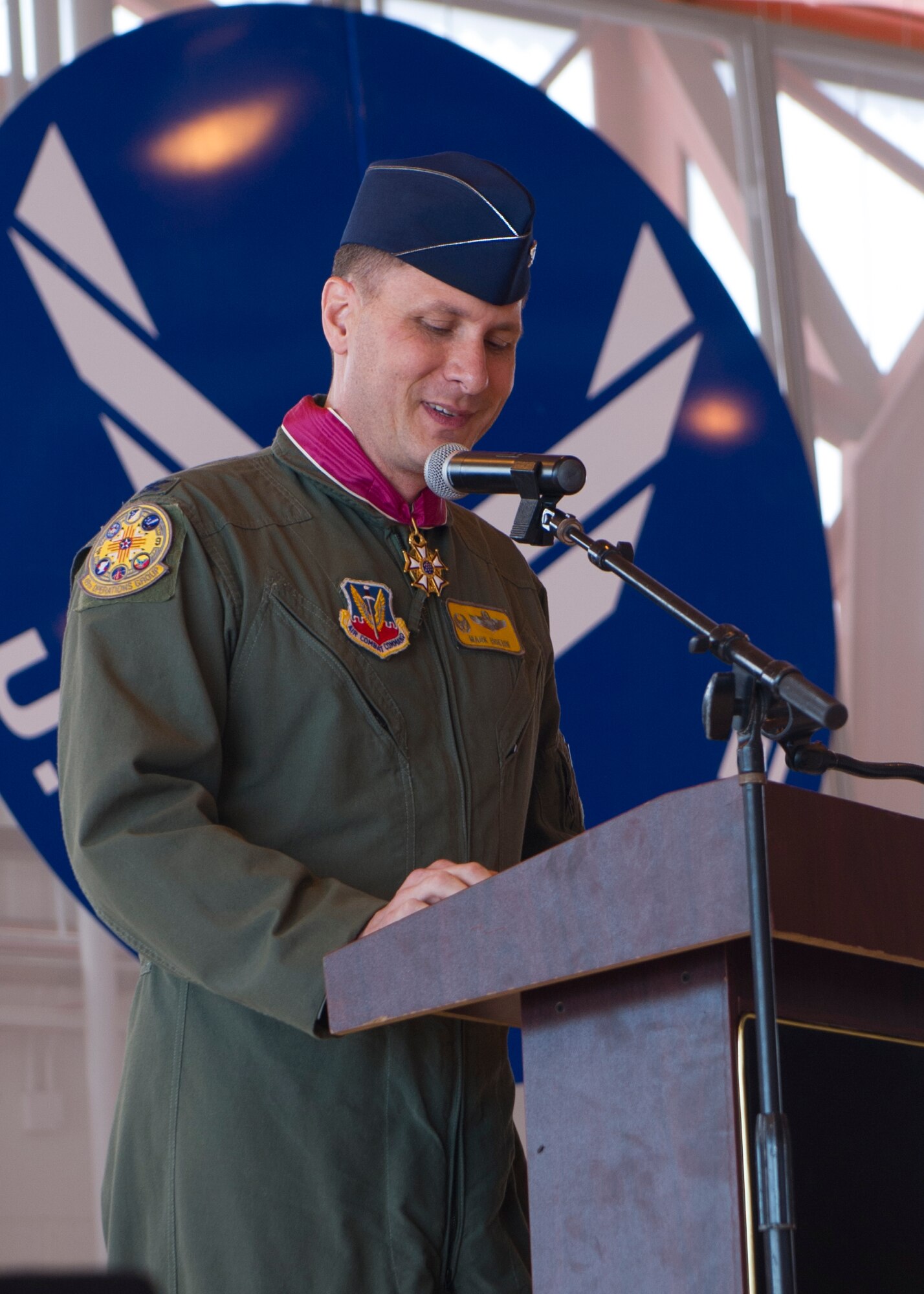 Col. Mark Hoehn, outgoing 49th Operations Group commander, delivers a departure speech during the 49th OG Change of Command June 19, 2015 at Holloman Air Force Base, N.M. During the ceremony, Col. Mark Hoehn relinquished command of the 49th OG to Col. Ryan Sherwood. (U.S. Air Force photo by Airman 1st Class Emily A. Kenney/Released)