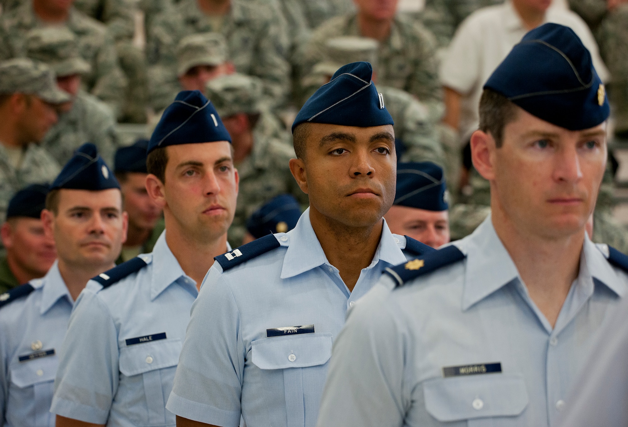 Capt. Degen Fain, 29th Training Systems Squadron, and other officers stand in formation prior to the 53rd Wing change of command ceremony June 18 at Eglin Air Force Base, Fla.  Col. Adrian Spain assumed command of the wing from Col. Alexus Grynkewich, who moves on to the Pentagon.  (U.S. Air Force photo/Samuel King Jr.)