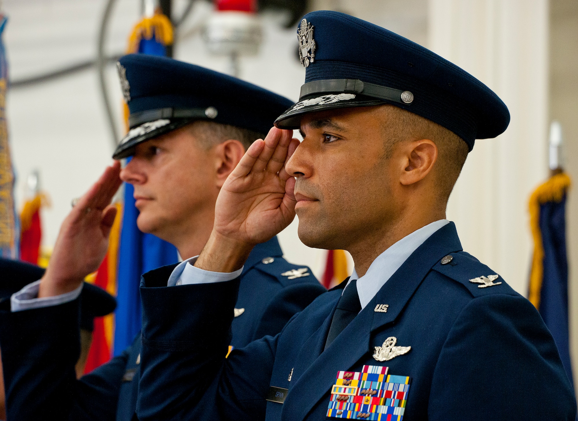 Colonels Adrian Spain and Alexus Grynkewich salute during the national anthem at the 53rd Wing change of command ceremony June 18 at Eglin Air Force Base, Fla.  Spain assumed command of the wing from Grynkewich, who moves on to the Pentagon.   (U.S. Air Force photo/Samuel King Jr.)