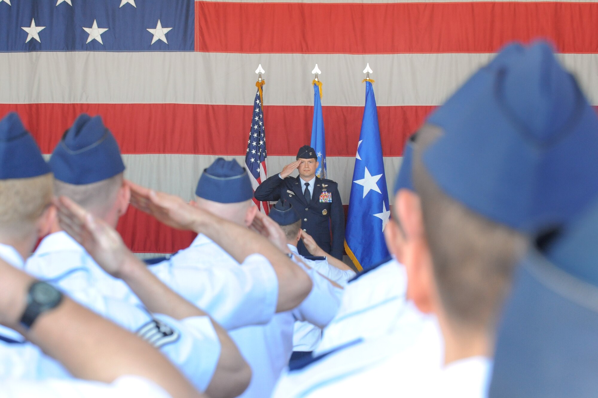 Airmen of 388th Fighter Wing render their first salute to their new wing commander, Col. David B. Lyons. (U.S. Air Force photo by Todd Cromar)
