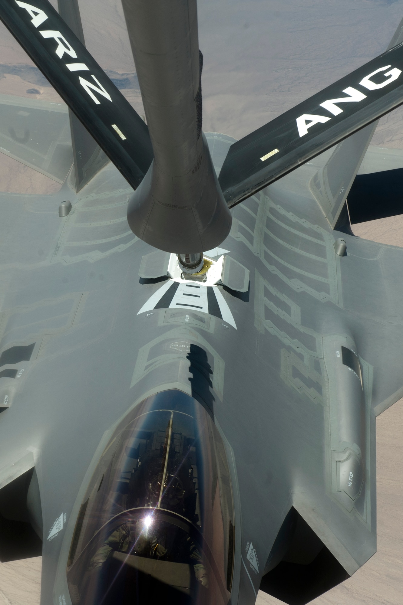 F-35 Lightning IIs from the 61st Fighter Squadron train air-to-air refueling operations with the 161st Air Refueling Wing, June 5, 2015. (U.S. Air Force photo by Staff Sgt. Staci Miller))