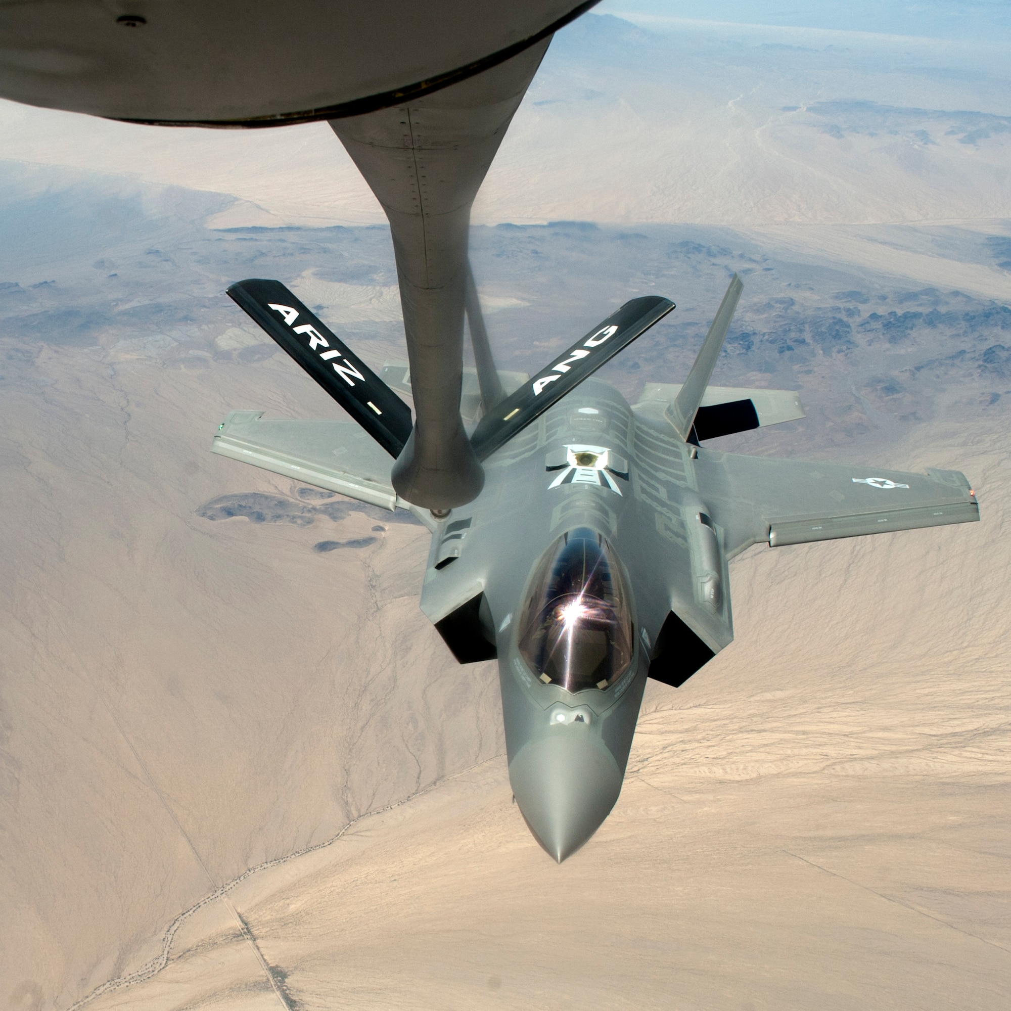 F-35 Lightning IIs from the 61st Fighter Squadron train air-to-air refueling operations with the 161st Air Refueling Wing, June 5, 2015. (U.S. Air Force photo by Staff Sgt. Staci Miller))