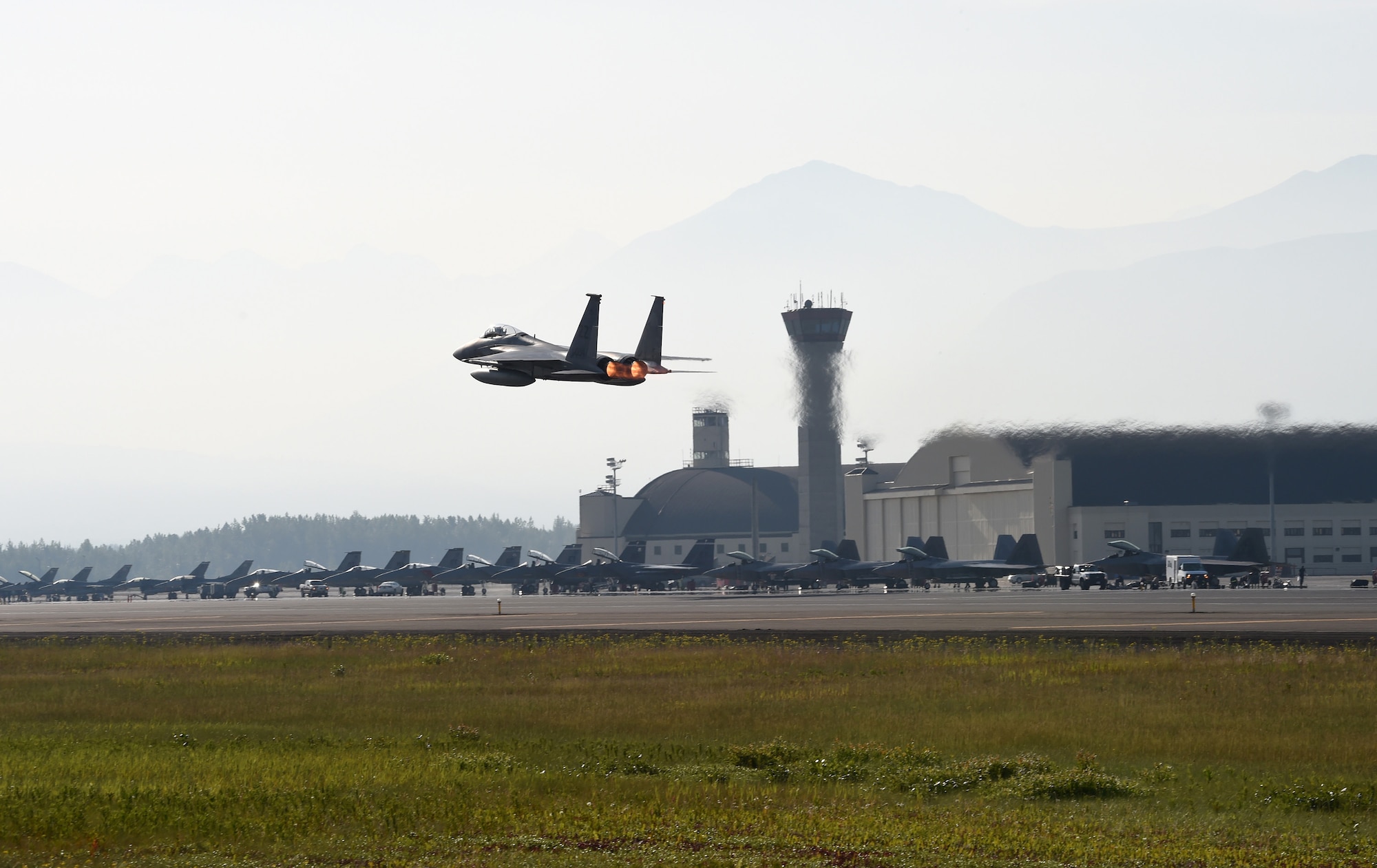 A U.S. Air Force F-15C Eagle launches from Joint Base Elmendorf-Richardson to participate in Exercise Northern Edge, June 18, 2015. Over 200 military aircraft from all services practiced operations, techniques and procedures while simultaneously enhancing interoperability during Northern Edge 2015 – Alaska’s premier joint training exercise. (U.S. Navy photo/Chief Mass Communication Specialist Larry Foos)