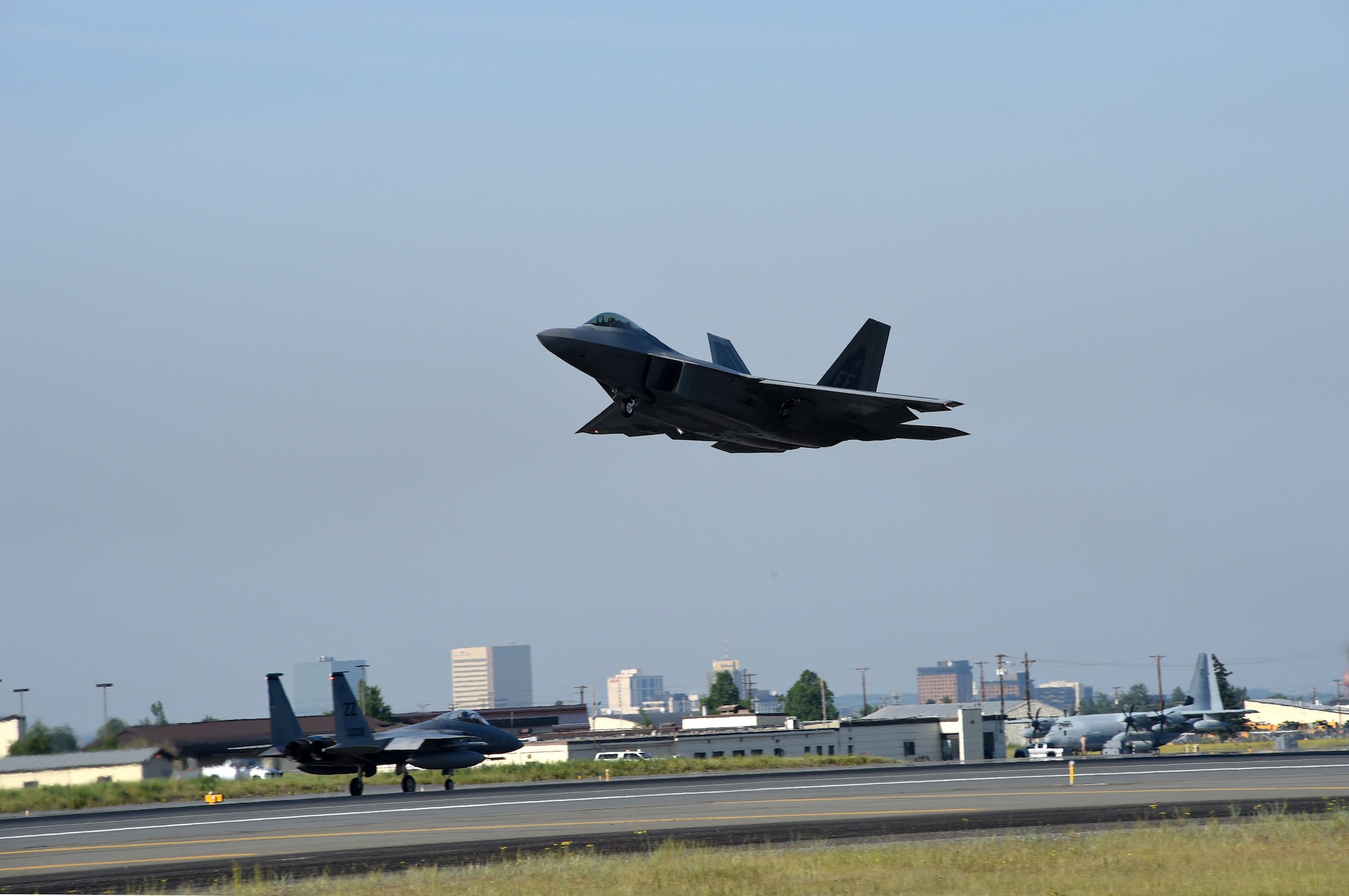A U.S. Air Force F-22 Raptor of the 1st Fighter Wing, Langley Air Force, Virginia launches from Joint Base Elmendorf-Richardson, Alaska to participate in Exercise Northern Edge, June 18, 2015. Over 200 military aircraft from all services practiced operations, techniques and procedures while simultaneously enhancing interoperability during Northern Edge 2015 – Alaska’s premier joint training exercise. (U.S. Navy photo/Chief Mass Communication Specialist Larry Foos)