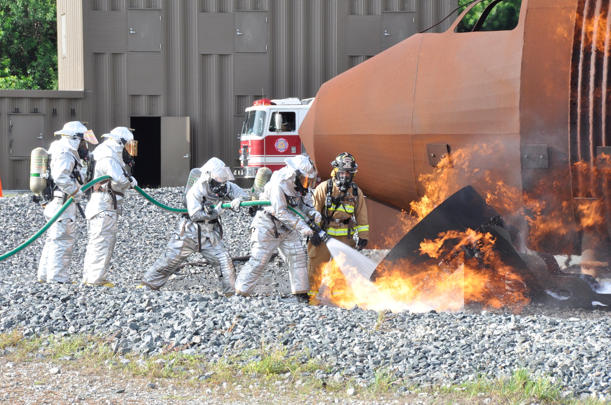 Brig. Gen. Chris Funk participates in live fire exercise with The 482nd Civil Engineering Squadron Prime BEEF (base engineer emergency force) Fire Flight at Homestead Air Reserve Base, Fla., June 13. The aircraft live fire training consists of responding to the fire, setting up on the aircraft, deploying hose lines, and attacking and extinguishing the fire. (U.S. Air Force photo by Senior Airman Nicholas Caceres)
