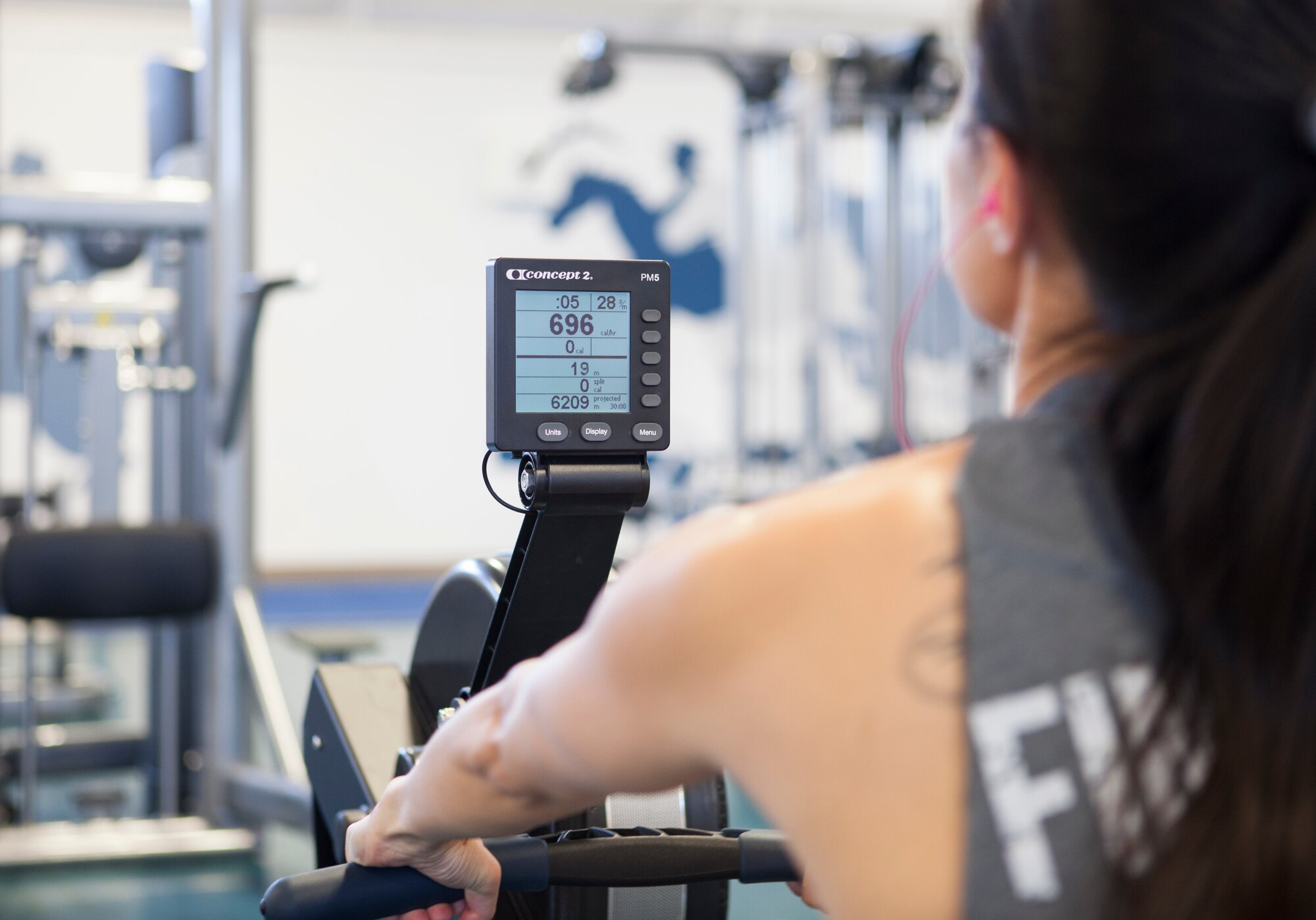 Shonda Nichols, spouse of Tech. Sgt. Aaron Nichols, 90th Civil Engineer Squadron, uses the rowing machine at Independence Hall Fitness Center on F.E. Warren Air Force Base, Wyo., June 17, 2015. Nichols was rowing as part of an endurance training workout. (U.S. Air Force photo by Lan Kim)